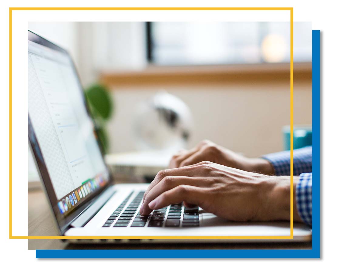 Closeup of someone using a laptop