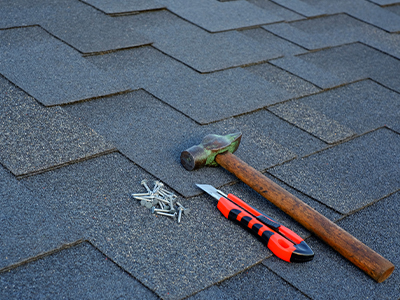 shingles on a roof and tools