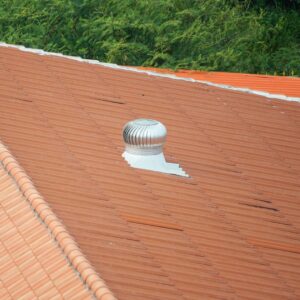 Wide shot of roof with large steel vent