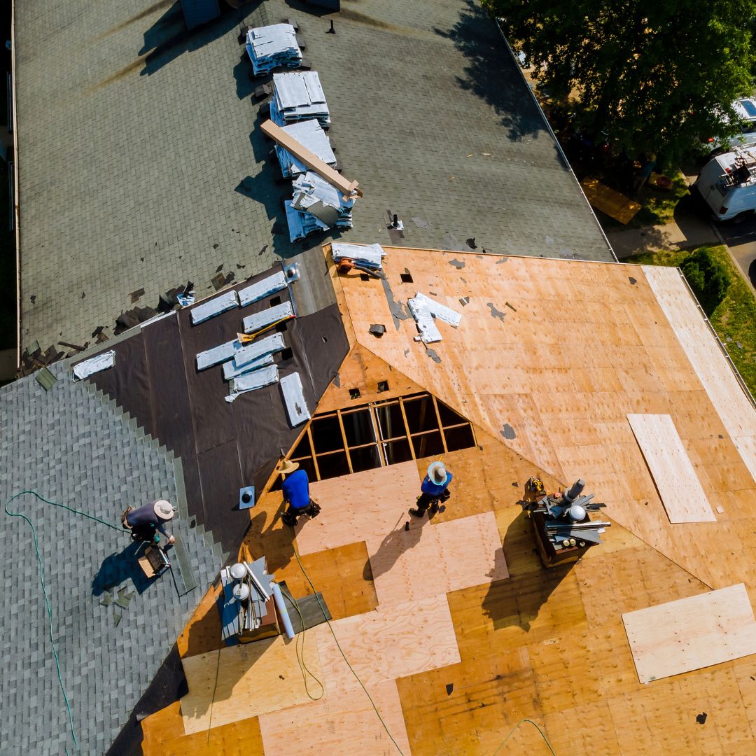 people installing a roof