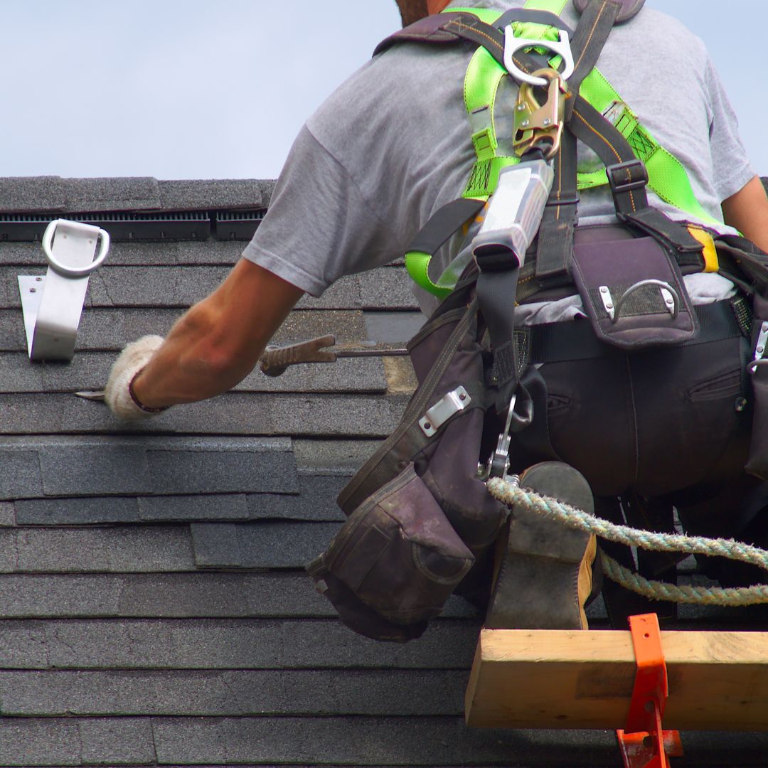 Roofer With A Harness On